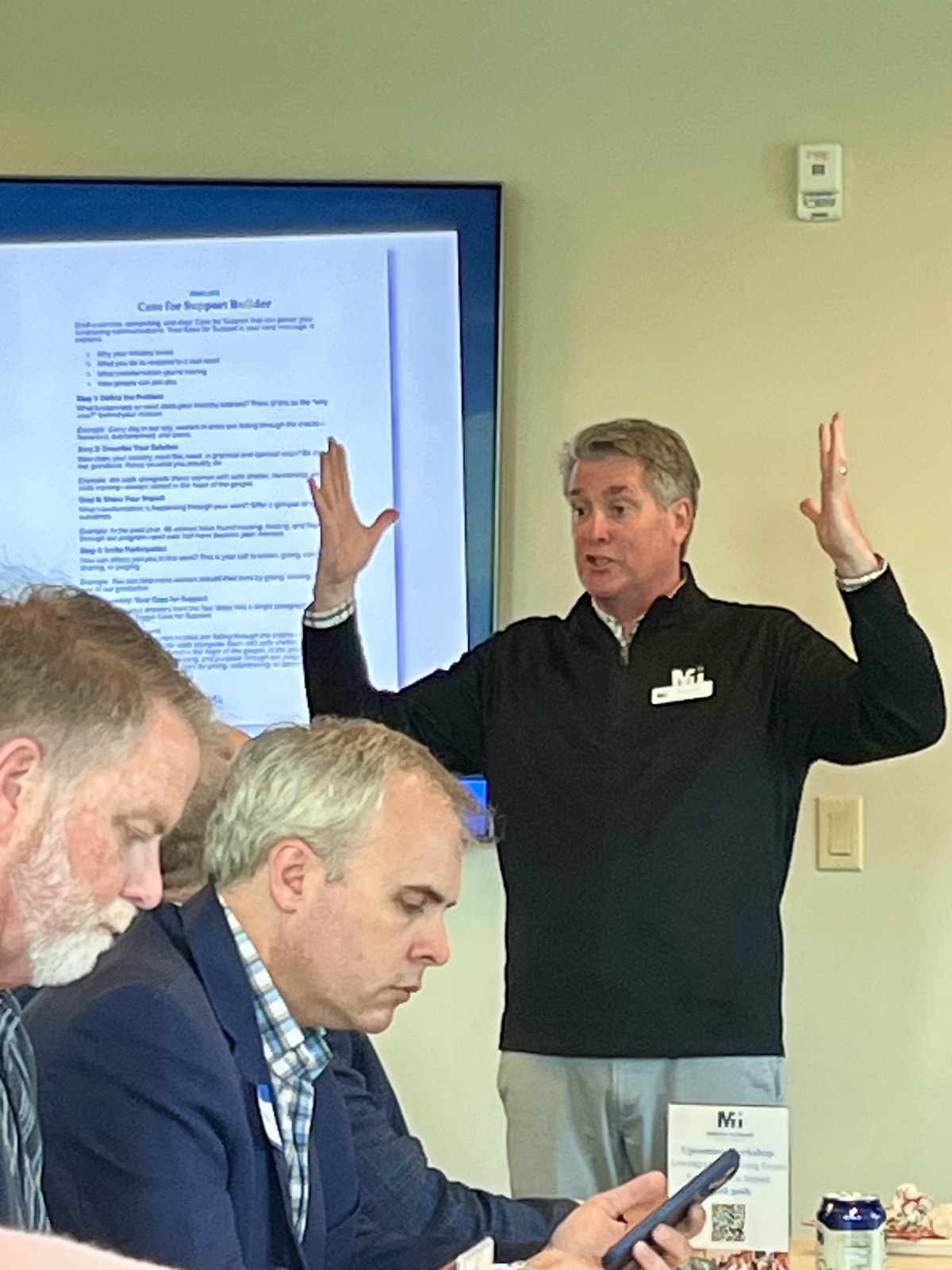 Brian Green teaching a Case for Support session in front of a projected worksheet